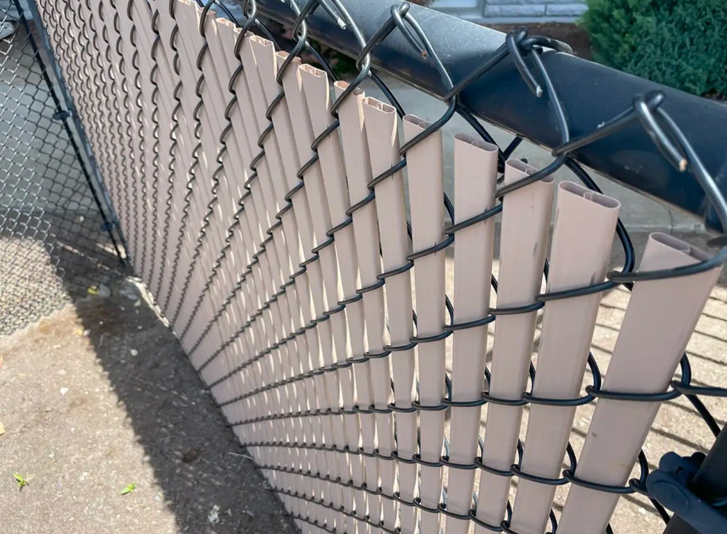 Chain-link fence with privacy slats for enhanced security in Santa Cruz