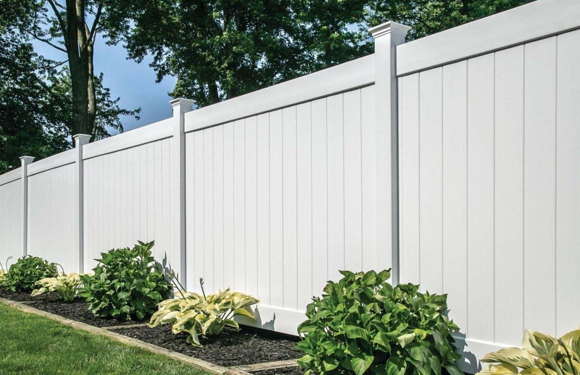 White vinyl privacy fence installation for residential properties